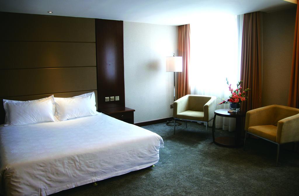 New Gloria Plaza Garden Hotel Харбин Экстерьер фото