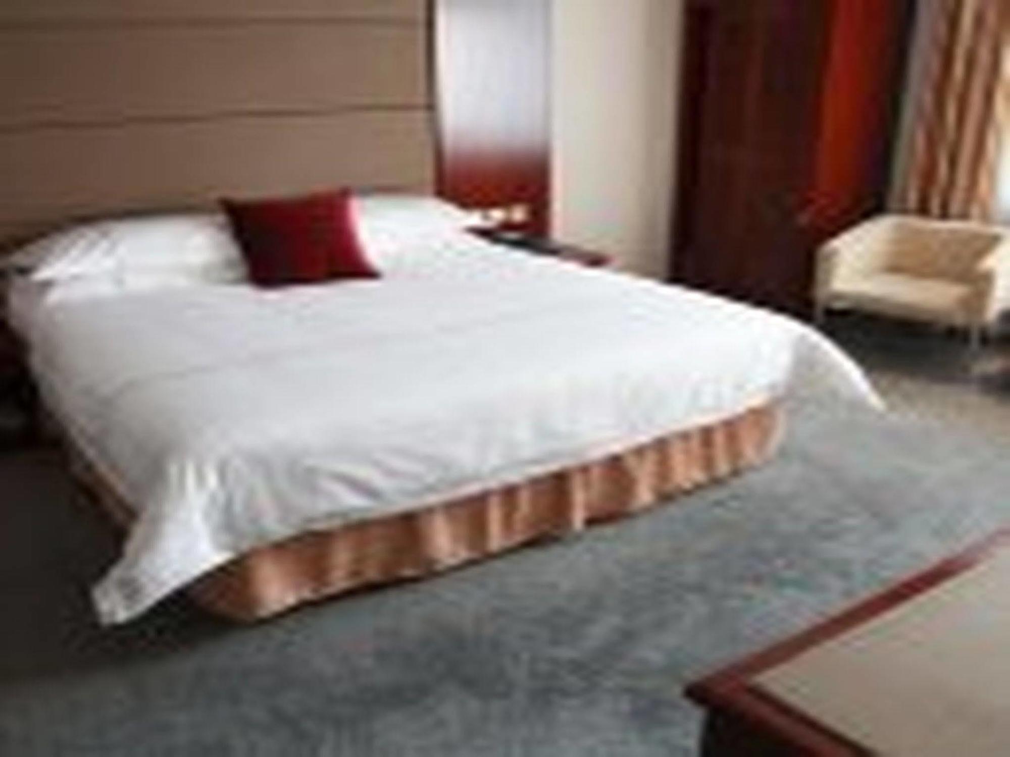 New Gloria Plaza Garden Hotel Харбин Экстерьер фото